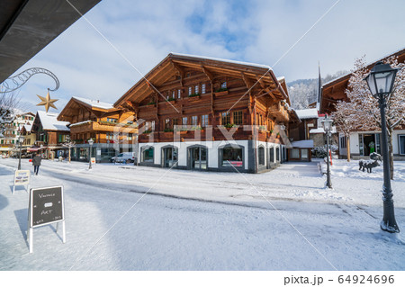 Wood chalet in Gstaad village in winter time 64924696