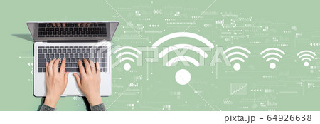 Wifi theme with person using laptop computer 64926638