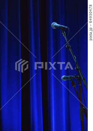 Microphone in front of stage curtain 64930478