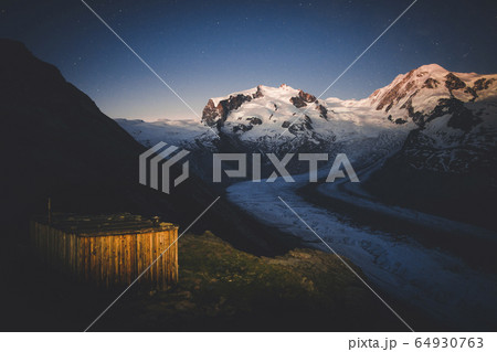 Shed by Gorner Glacier at sunset in Valais, Switzerland 64930763