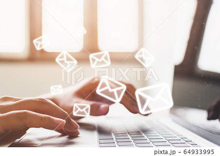 Email marketing and newsletter concept. Hand of man sending message and laptop with e-mail icon 64933995