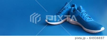 Colorful sport shoes on blue color backround Colorful sport shoes on blue color backround 64936697