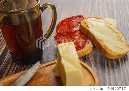 Fresh wheat toast with butter, sausage and cheese, Fresh wheat toast with butter, sausage and cheese, 64940757