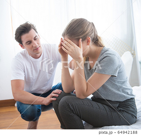 sad man sit in bed and thinking with man comfort 64942188