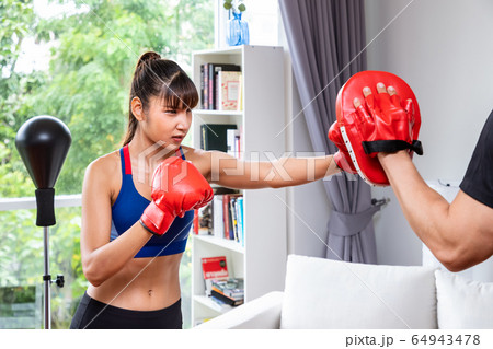 Beautiful woman female practice boxing training 64943478
