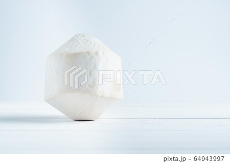 Tropical drinking coconut on white wood background. Tropical drinking coconut on white wood background. 64943997