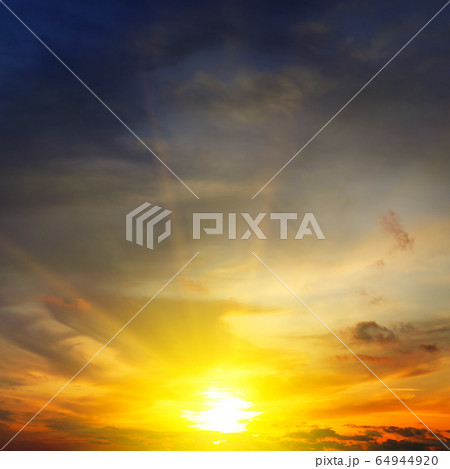 Dramatic sunset with bright rays and clouds Dramatic sunset with bright rays and clouds 64944920