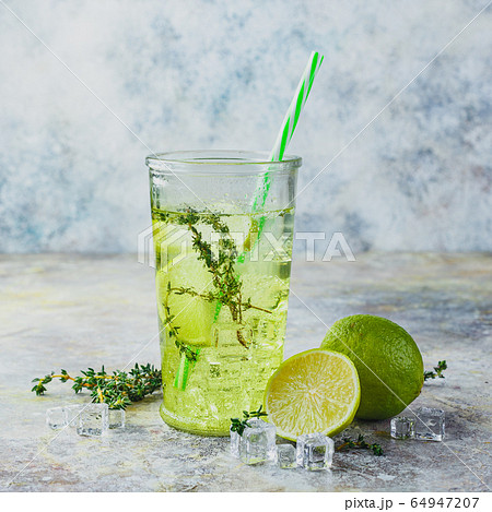 Lime Lemonade with thyme and ice. 64947207