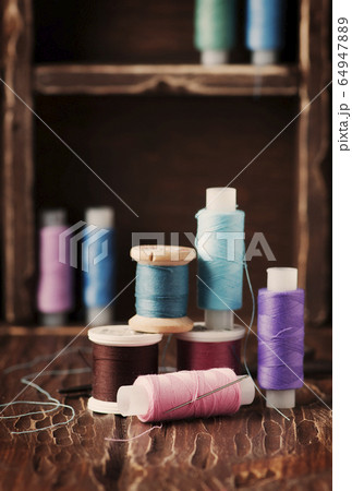 Color threads on the vintage table Color threads on the vintage table 64947889