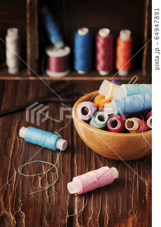 Color threads on the vintage table Color threads on the vintage table 64947891