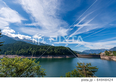 Alpine lake with dam - Lago di Paneveggio Trentino Alto Adige Italy 64948424