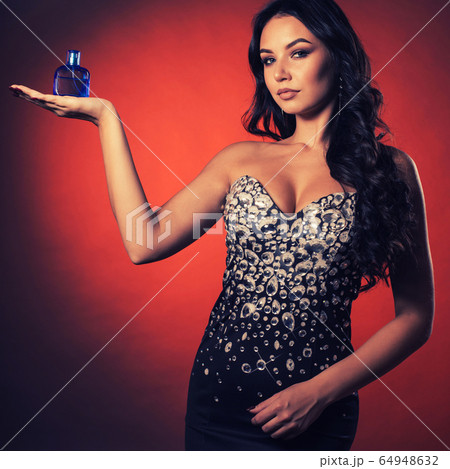 Beautiful young girl in a dress with rhinestones Beautiful young girl in a dress with rhinestones 64948632