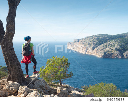 Mallorca shore mountain trail. Woman enjoy island Mallorca shore mountain trail. Woman enjoy island 64955933