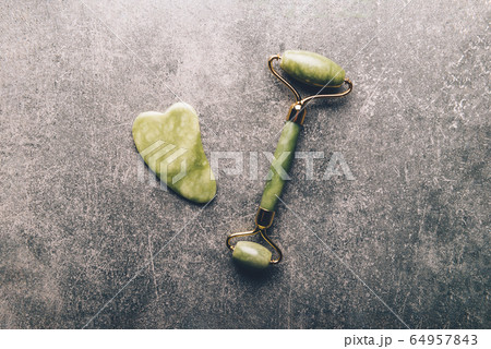 Jade face roller and Gua sha stone 64957843