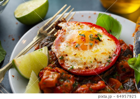 Fried egg with vegetables on plate Fried egg with vegetables on plate 64957925