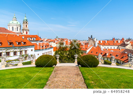 Vrtbovska Garden in Prague. Terraced baroque garden and overview of Lesser Town with St Nicholas Church dome, Prague, Czech Republic Vrtbovska Garden in Prague. Terraced baroque garden and overview of Lesser Town with St Nicholas Church dome, Prague, Czech Republic 64958248