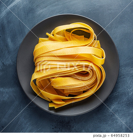 Homemade pasta served on plate Homemade pasta served on plate 64958253