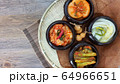 Korean different kinds of Kimchi  in traditional dishes in the wooden basket 64966651