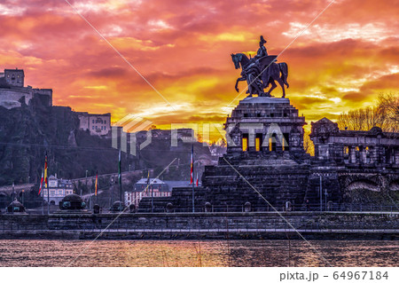 Colorful Sunrise burning sky Koblenz City historic monument German Corner where river rhine and mosele flow together 64967184