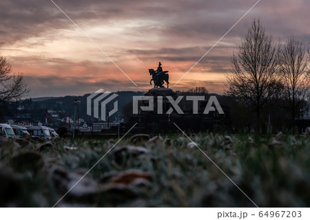 Colorful Sunrise burning sky Koblenz City historic monument German Corner where river rhine and mosele flow together 64967203