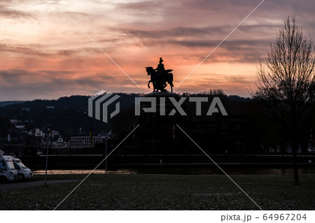 Colorful Sunrise burning sky Koblenz City historic monument German Corner where river rhine and mosele flow together 64967204