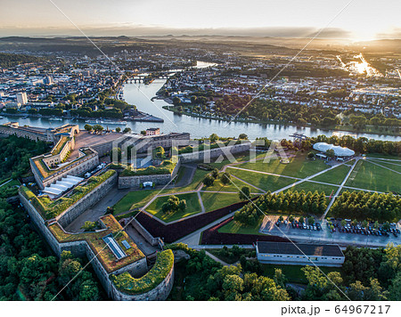 Aerial View of Ehrenbreitstein fortress and Koblenz City in Germany during sunset Aerial View of Ehrenbreitstein fortress and Koblenz City in Germany during sunset 64967217