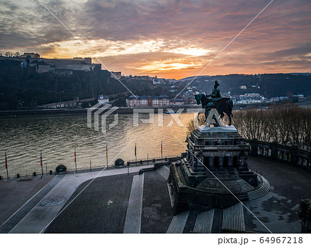 Colorful Sunrise burning sky Koblenz City historic monument German Corner where river rhine and mosele flow together 64967218