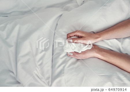 Close up of hands that holding serviette Close up of hands that holding serviette 64970914