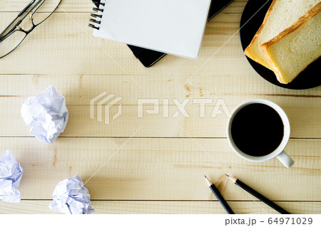 cup of hot coffee  on wooden background with 64971029