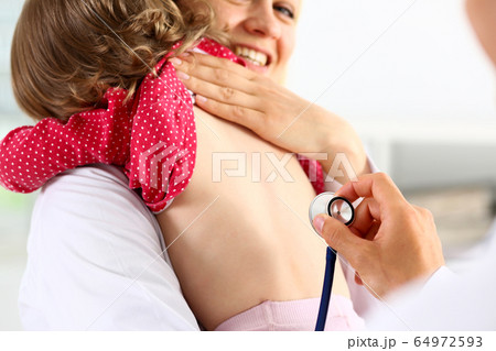 Little child with stethoscope at doctor reception Little child with stethoscope at doctor reception 64972593