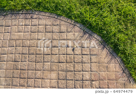 Stamped concrete pavement outdoor cobblestones pattern Stamped concrete pavement outdoor cobblestones pattern 64974479