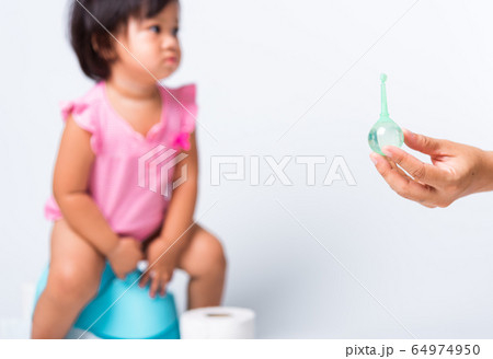 baby child girl training to sitting on blue 64974950