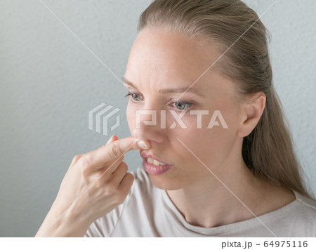 Gymnastics for the face. Woman does rejuvenating  64975116