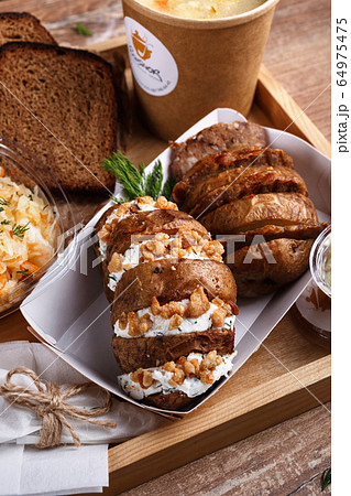 Street food. Lemon tea, salad, baked potatoes with Street food. Lemon tea, salad, baked potatoes with 64975475