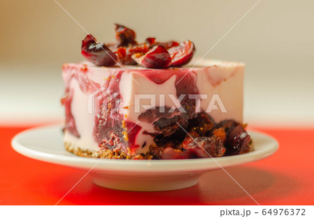 Japanese cheesecake with cherry sauce and fresh 64976372