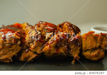 Pork ribs in a smoky flavour barbecue seasoning Pork ribs in a smoky flavour barbecue seasoning 64976397
