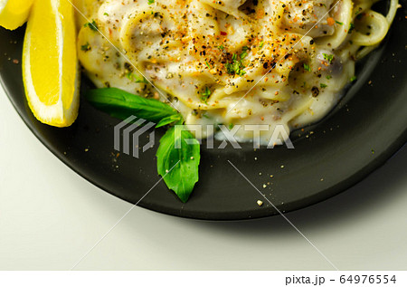 Carbonara, spaghetti with a cheese and smoked Carbonara, spaghetti with a cheese and smoked 64976554