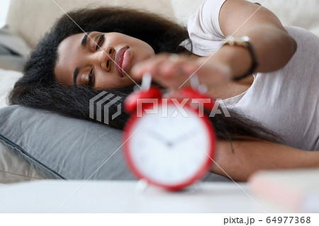 Woman waking up 64977368
