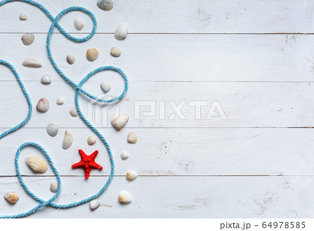 Marine items on turquoise painted wooden 64978585