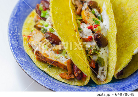 Mexican tacos shells with chicken and red kidney Mexican tacos shells with chicken and red kidney 64978649