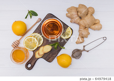 Healthy vitamin ginger tea with honey and lemon 64979418