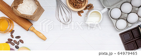 Ingredients and utensil for baking on white background Ingredients and utensil for baking on white background 64979465