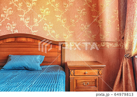 Warm tones cozy bedroom interior close up 64979813