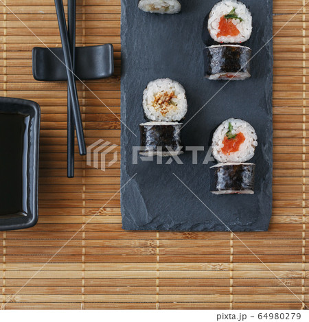 Traditional Japanese cuisine - sushi on a Traditional Japanese cuisine - sushi on a 64980279