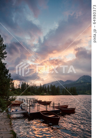 Calm lake, fantastic mountains and the clouds the 64980373