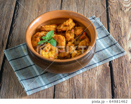 King Prawn Masala in a clay bowl. King Prawn Masala in a clay bowl. 64981462