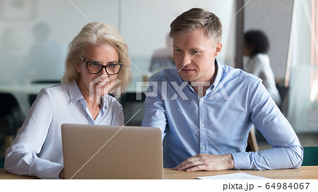 Middle aged manager make business offer to client on laptop 64984067