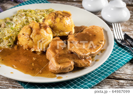 Stewed turkey meat in gravy. Stewed turkey meat in gravy. 64987099