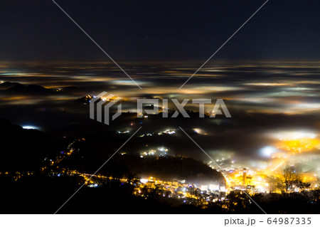 Plain illuminated partially covered by fog, soft 64987335