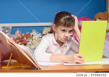 Upset girl dissatisfied with distance learning Upset girl dissatisfied with distance learning 64988268